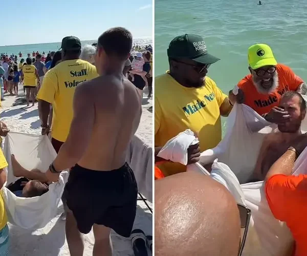 Paralítico é carregado por amigos para se batizar em praia nos EUA
